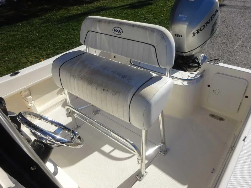 Slide: The Image of 2006 Key West 186 Sportsman boat interior with Honda outboard motor and steering wheel. - 17