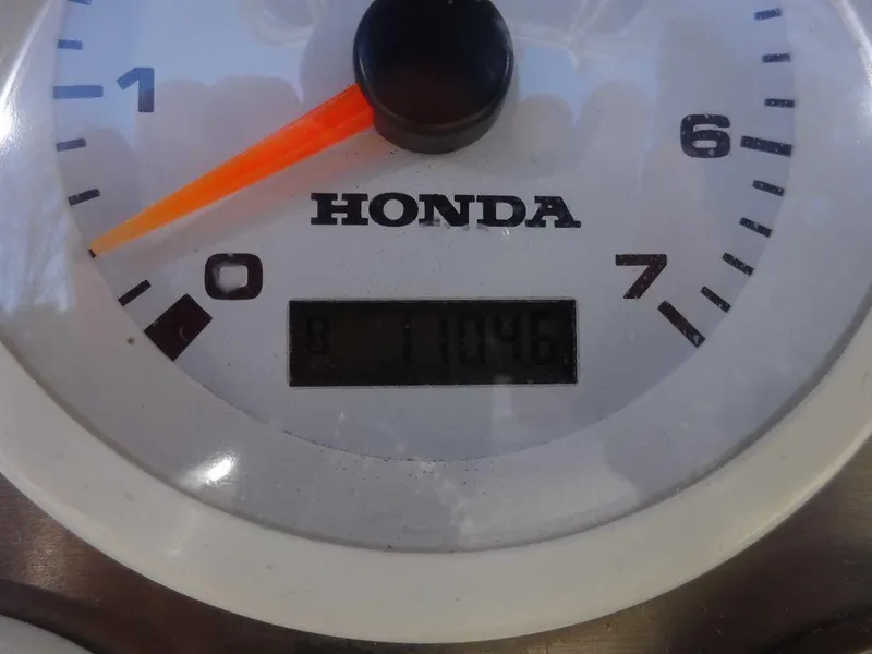 Slide: The Image of Close-up of a Honda boat tachometer displaying 1104.6 hours, from a 2006 Key West 186 Sportsman. - 22
