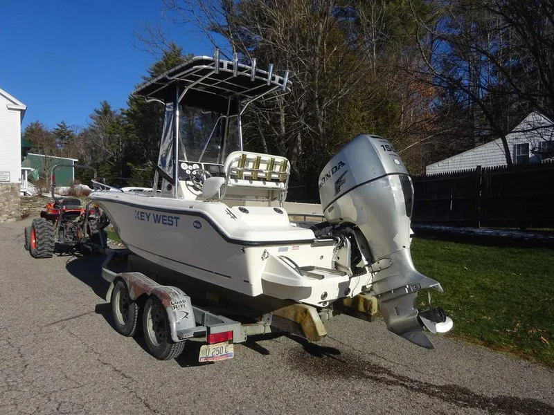 Slide: The Image of 2006 Key West 186 Sportsman boat on trailer, parked outdoors. - 3