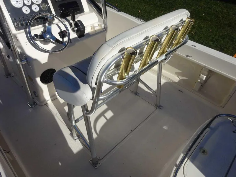 Slide: The Image of 2006 Key West 186 Sportsman boat interior with steering wheel and rod holders. - 5