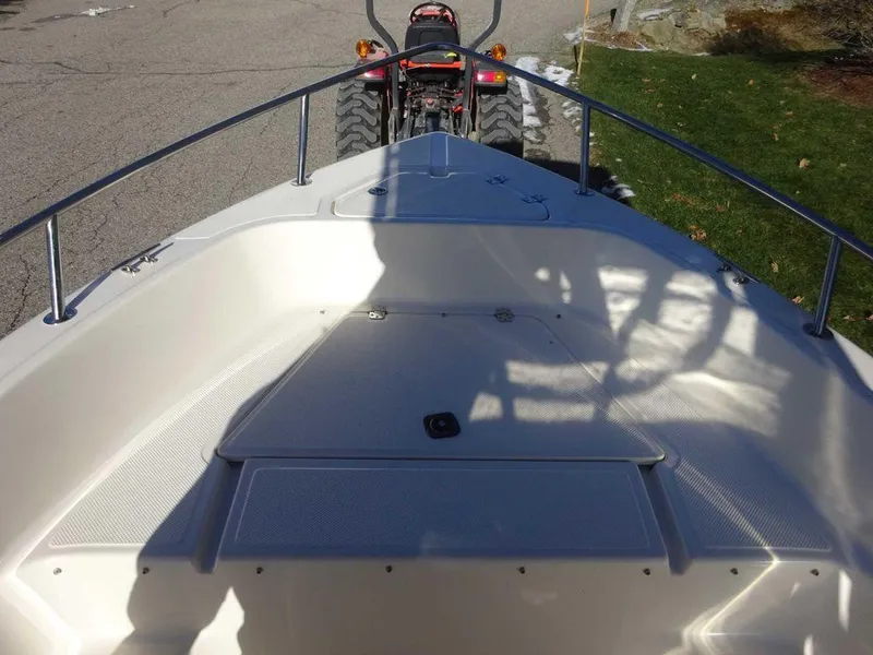 Slide: The Image of 2006 Key West 186 Sportsman boat bow with tractor in background. - 8