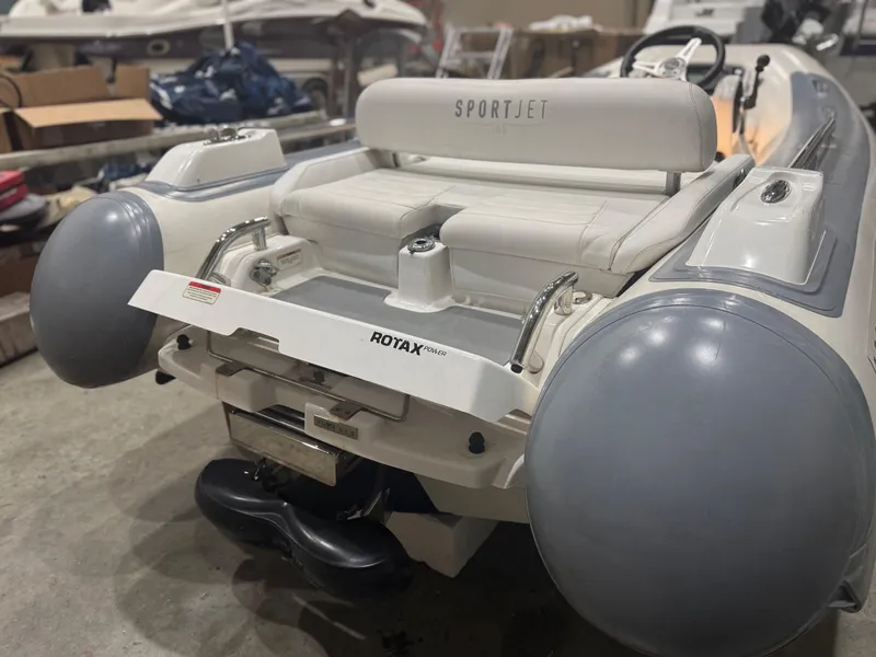 Slide: The Image of 2020 Williams Jet Tenders Sportjet 345, rear view in a storage area. - 11