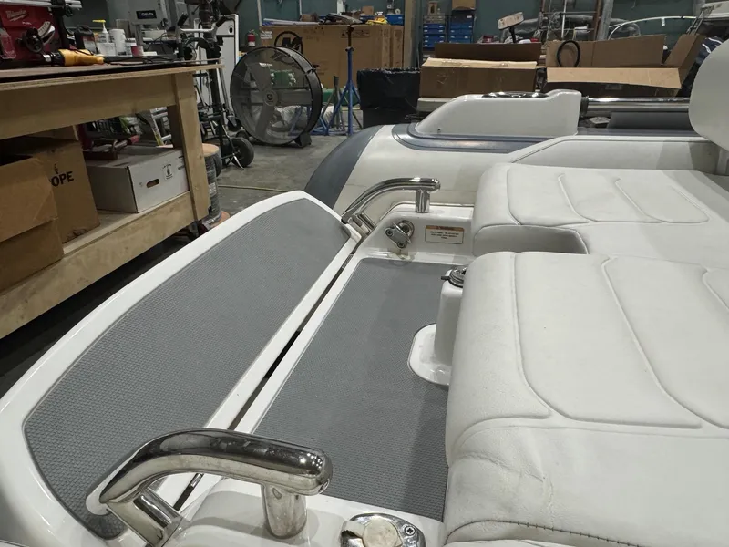 Slide: The Image of 2020 Williams Jet Tenders Sportjet 345 interior with white seating and stainless steel handles. - 13