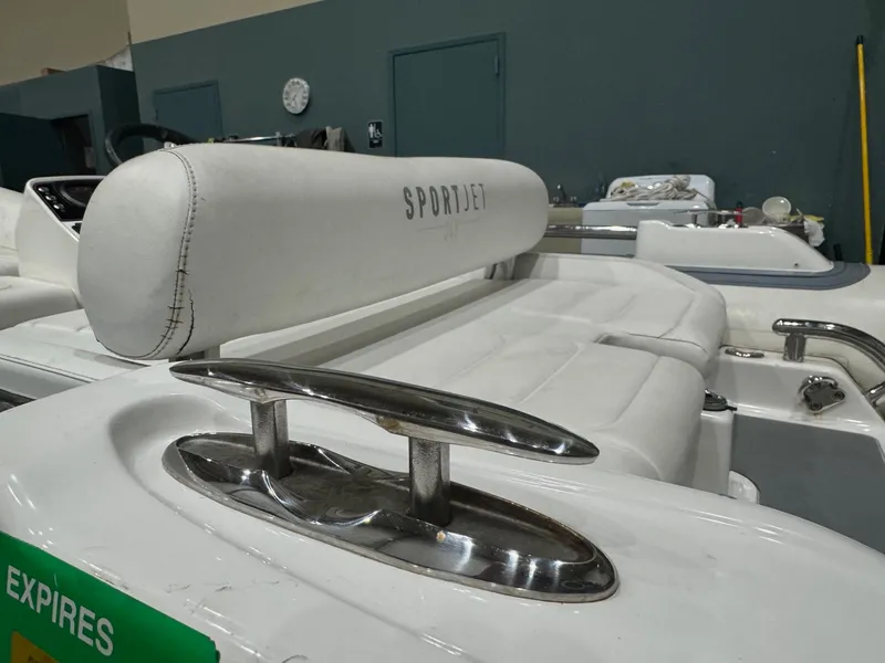 Slide: The Image of 2020 Williams Jet Tenders Sportjet 345, white seating and chrome details in a showroom. - 15