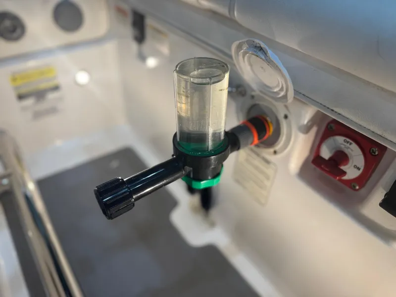 Slide: The Image of Close-up of a 2020 Williams Jet Tenders Sportjet 345 control panel with a fuel filter. - 17