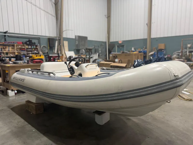 Slide: The Image of 2020 Williams Jet Tenders Sportjet 345 in a workshop setting. - 2