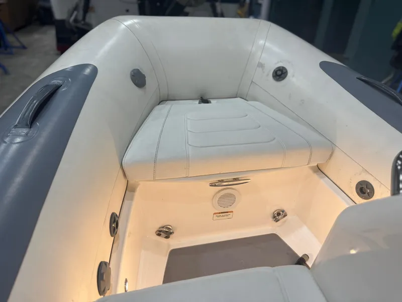 Slide: The Image of 2020 Williams Jet Tenders Sportjet 345 interior with white seating and ambient lighting. - 7