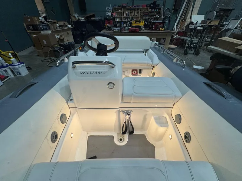 Slide: The Image of 2020 Williams Jet Tenders Sportjet 345 interior with illuminated seating and controls. - 8