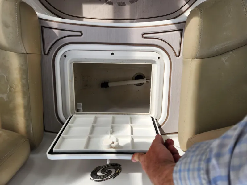 Slide: The Image of 2019 Hurricane SunDeck 187 OB boat storage compartment with open hatch. - 11