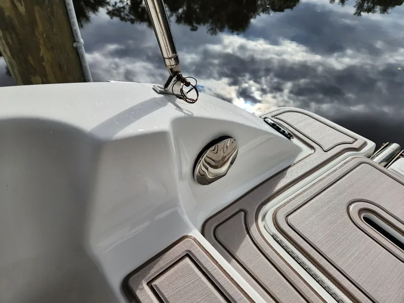 Slide: The Image of Close-up of 2019 Hurricane SunDeck 187 OB boat deck with water reflection. - 17