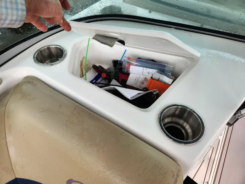 Slide: The Image of Storage compartment on 2019 Hurricane SunDeck 187 OB boat with cup holders. - 21
