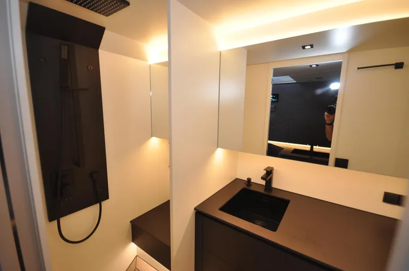 Slide: The Image of Luxurious bathroom interior of 2023 Vanquish Yachts VQ45 with modern fixtures. - 12