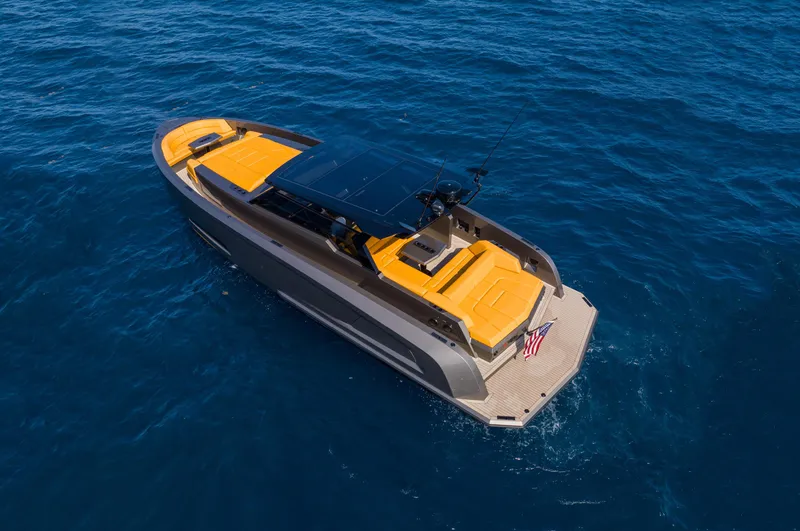 Slide: The Image of 2023 Vanquish Yachts VQ45 luxury yacht cruising on open blue water. - 26