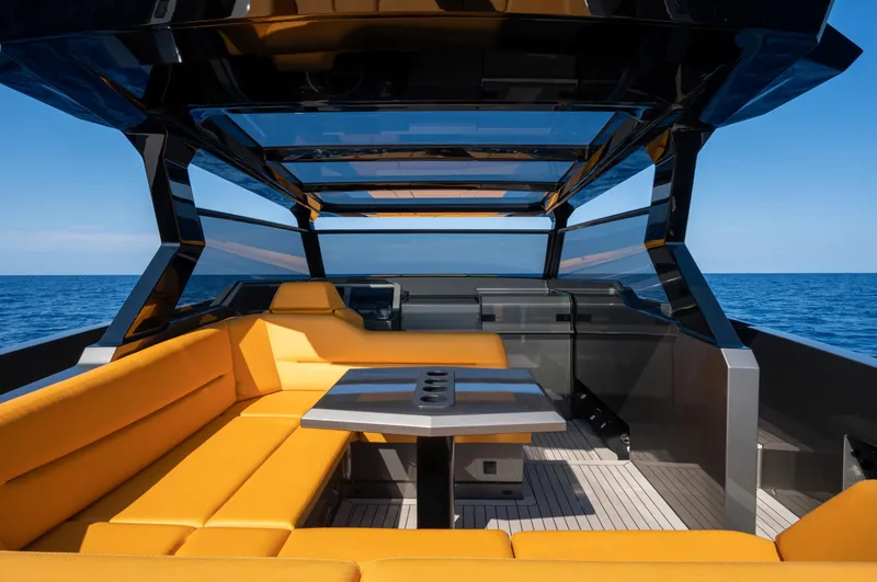 Slide: The Image of Luxurious 2023 Vanquish Yachts VQ45 with sleek design and vibrant orange seating. - 28
