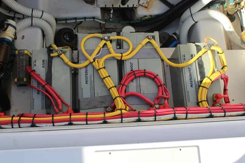 Slide: The Image of Battery compartment of 2006 Pro-Line 32 Express boat with wiring and connections. - 11