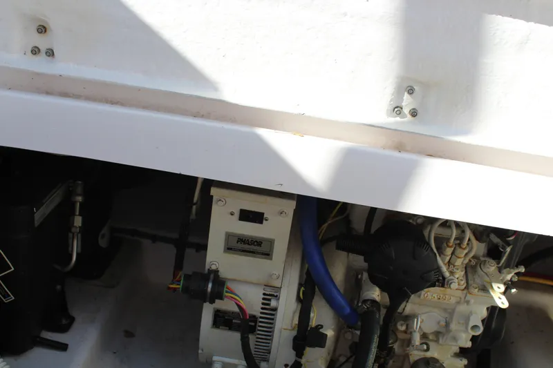 Slide: The Image of Engine compartment of 2006 Pro-Line 32 Express boat, showing mechanical components. - 12