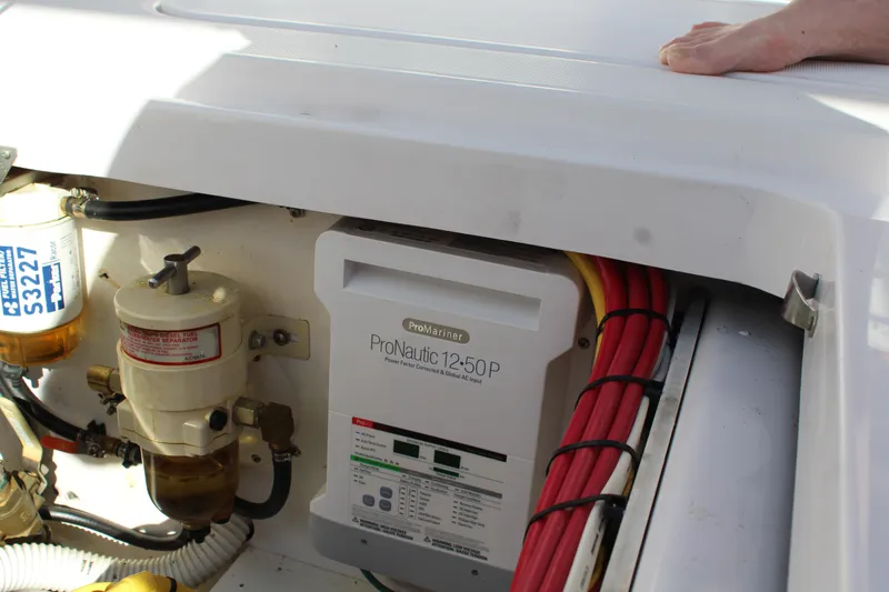 Slide: The Image of Engine compartment of 2006 Pro-Line 32 Express with ProNautic 1250P charger and fuel filter. - 13