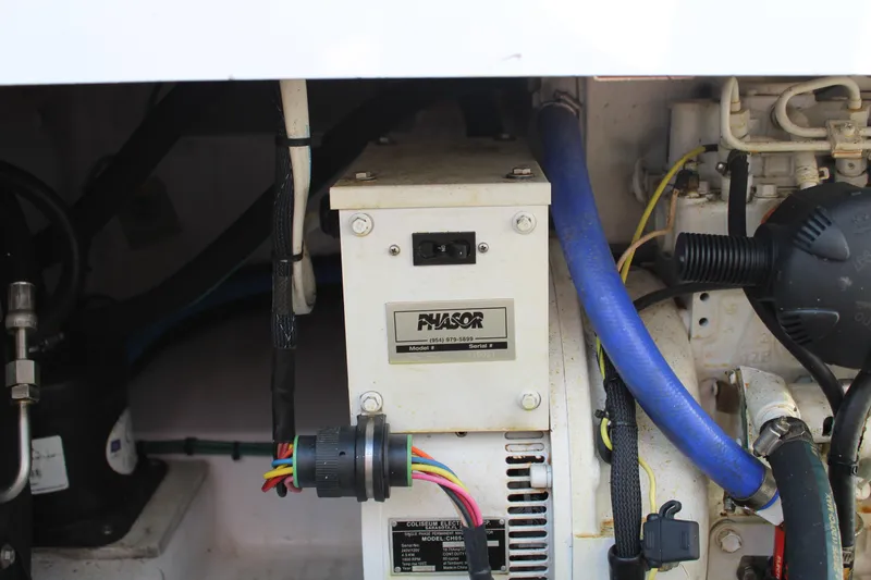 Slide: The Image of Engine compartment of 2006 Pro-Line 32 Express boat with Phasor generator. - 15