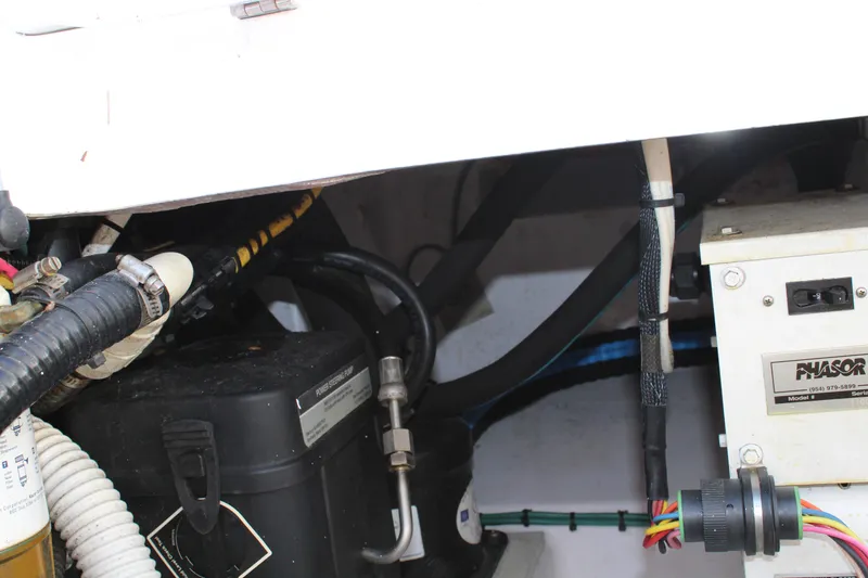 Slide: The Image of Engine compartment of 2006 Pro-Line 32 Express boat with wiring and components. - 17