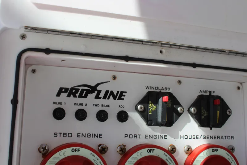 Slide: The Image of Control panel of 2006 Pro-Line 32 Express boat with engine and generator switches. - 18