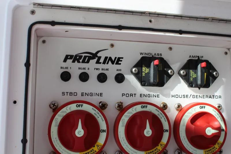 Slide: The Image of Control panel of a 2006 Pro-Line 32 Express boat with engine switches and circuit breakers. - 19