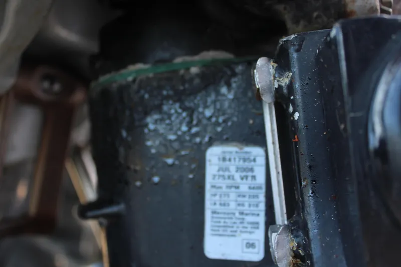 Slide: The Image of Close-up of a 2006 Pro-Line 32 Express engine component with a visible label. - 22