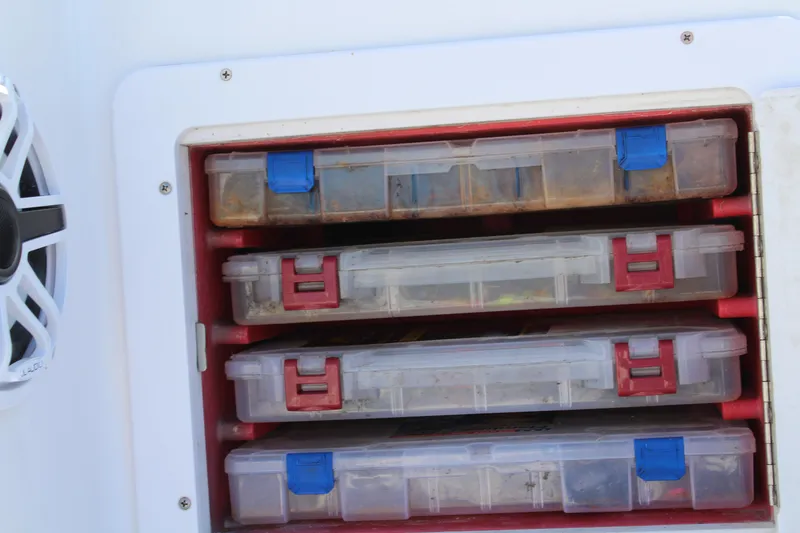 Slide: The Image of Tackle storage on 2006 Pro-Line 32 Express boat with organized plastic boxes. - 26