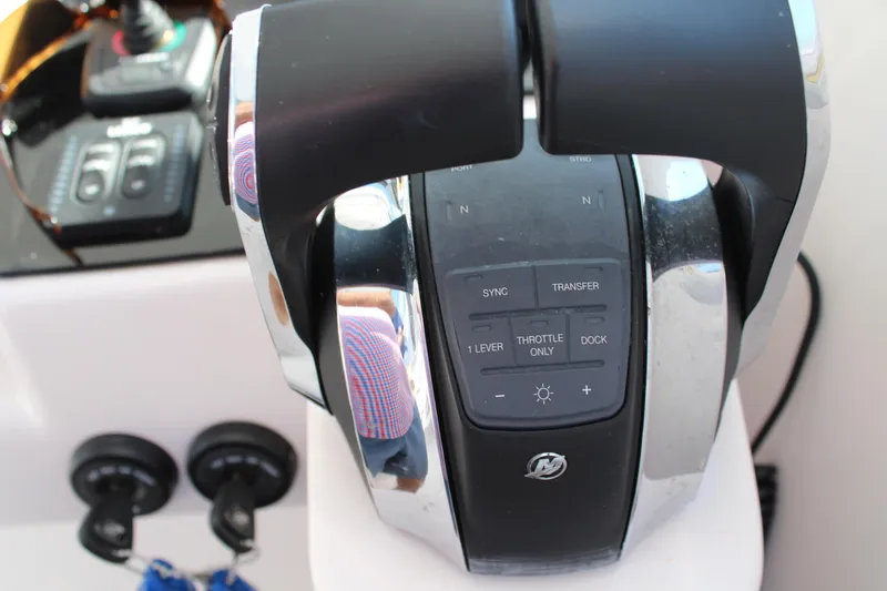 Slide: The Image of Close-up of 2006 Pro-Line 32 Express boat throttle controls. - 34