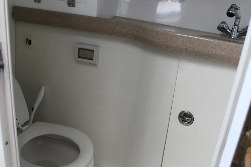 Slide: The Image of 2006 Pro-Line 32 Express boat bathroom with sink and toilet. - 41
