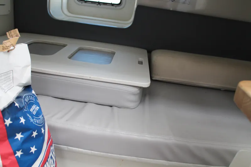 Slide: The Image of Interior cabin of 2006 Pro-Line 32 Express boat with seating and storage. - 44