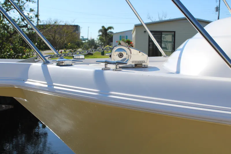 Slide: The Image of 2006 Pro-Line 32 Express boat deck with stainless steel fittings and clear blue sky. - 8
