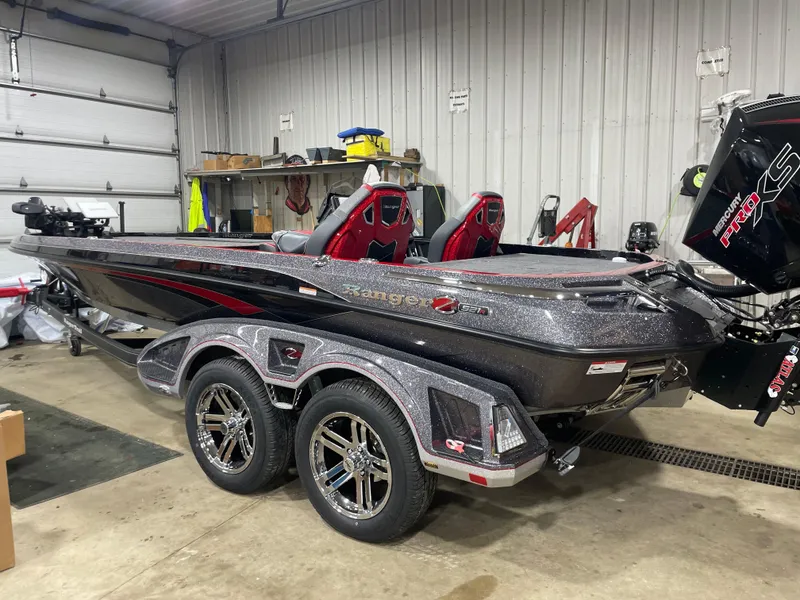 Slide: The Image of 2025 Ranger Z521R Cup-Equipped boat in garage, featuring sleek design and dual seats. - 2