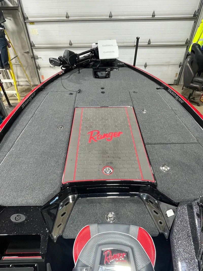 Slide: The Image of 2025 Ranger Z521R Cup-Equipped boat interior with branded deck and seating. - 7