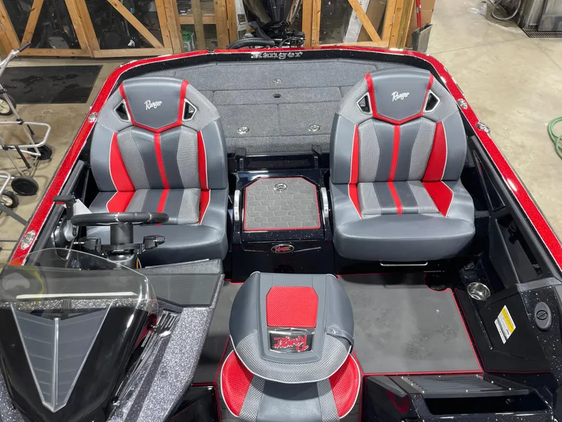 Slide: The Image of 2025 Ranger Z521R Cup-Equipped boat interior with red and gray seats. - 9