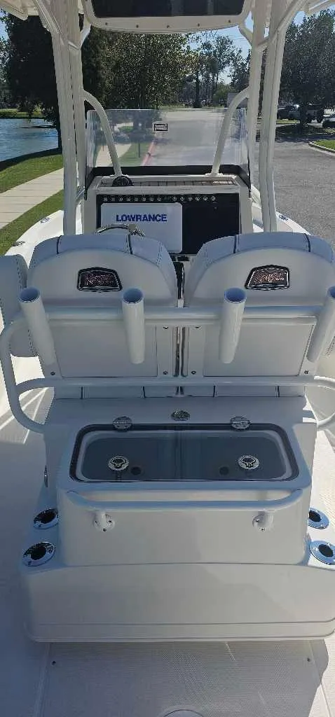 Slide: The Image of 2025 Ranger 2510 Bay boat interior with dual seats and control panel. - 3