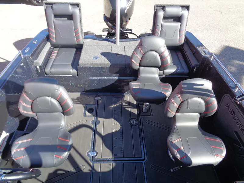 Slide: The Image of 2025 Nitro ZV19 Sport Pro boat interior with sleek black and red seating. - 6