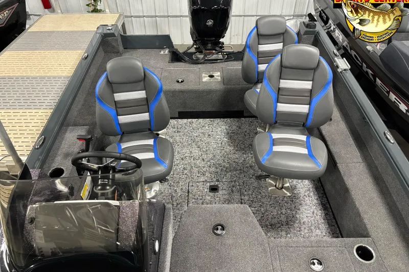 Slide: The Image of 2025 Ranger VS1682SC Angler boat interior with four gray and blue seats, steering wheel, and carpeted floor. - 7