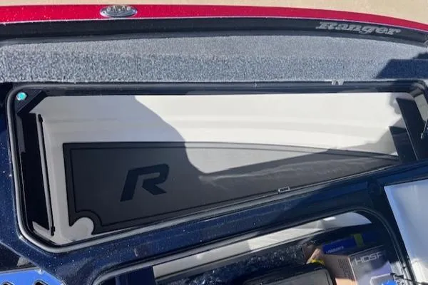 Slide: The Image of 2025 Ranger Z521R Cup-Equipped storage compartment with logo, showcasing sleek design and functionality. - 11