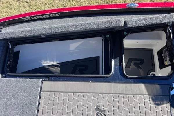 Slide: The Image of 2025 Ranger Z521R Cup-Equipped boat storage compartments with logo detailing. - 12