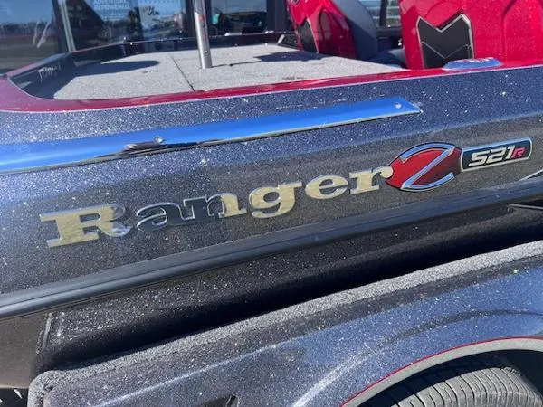 Slide: The Image of 2025 Ranger Z521R Cup-Equipped boat with metallic finish and red interior accents. - 2