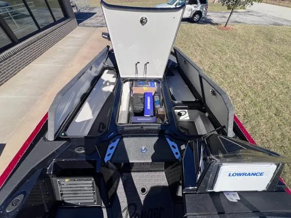 Slide: The Image of 2025 Ranger Z521R Cup-Equipped boat interior with storage compartments and Lowrance electronics. - 7