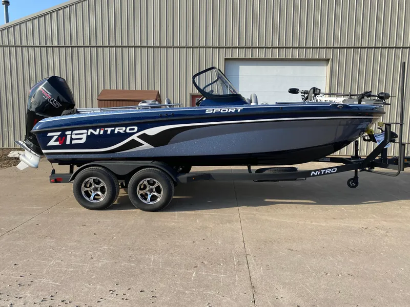 The Image of 2025 Nitro ZV19 Sport boat on trailer, parked outdoors. - 0