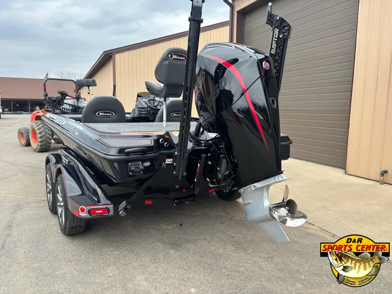 Slide: The Image of 2025 Triton 21XP boat with powerful outboard motor, parked near a building. - 3