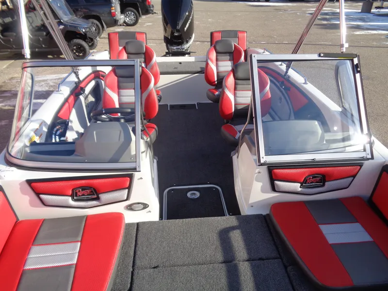 Slide: The Image of 2025 Ranger 2050MS boat interior with red and gray seating, open windshield. - 12
