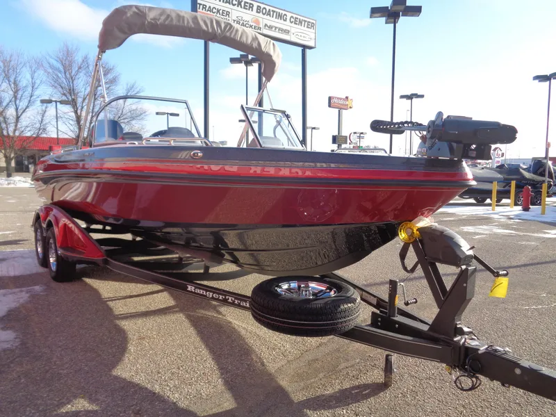 Slide: The Image of 2025 Ranger 2050MS boat on trailer in parking lot. - 2