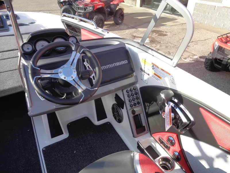 Slide: The Image of 2025 Ranger 2050MS boat dashboard with steering wheel and control panel. - 7