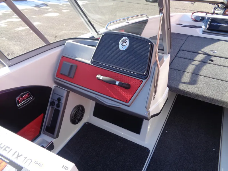 Slide: The Image of 2025 Ranger 2050MS boat interior with red accents and modern dashboard. - 8