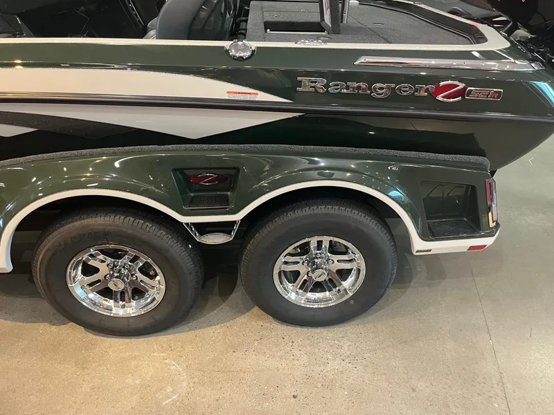 Slide: The Image of 2025 Ranger Z521R Cup-Equipped boat with dual axle trailer and chrome wheels. - 3