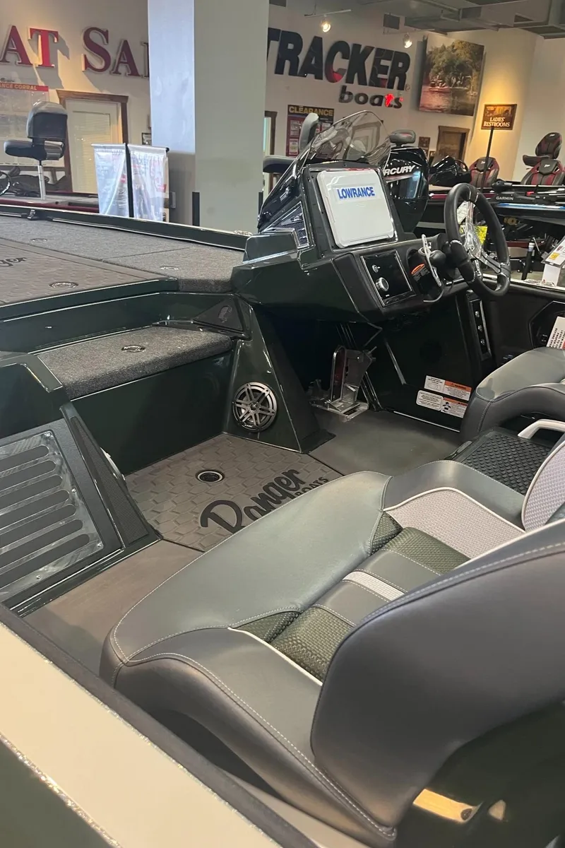 Slide: The Image of 2025 Ranger Z521R Cup-Equipped boat interior with modern dashboard and seating. - 4