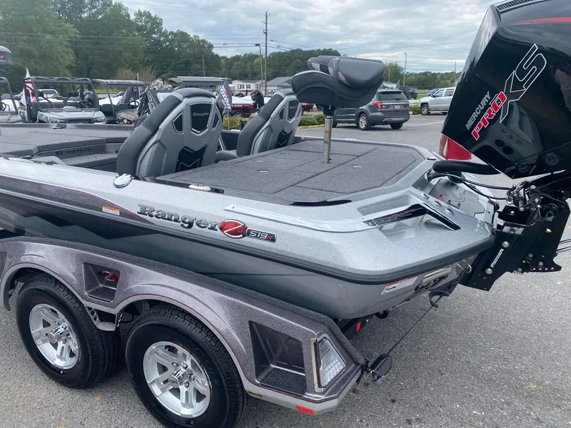 Slide: The Image of 2025 Ranger Z519R boat with dual seats and powerful engine, parked outdoors. - 1